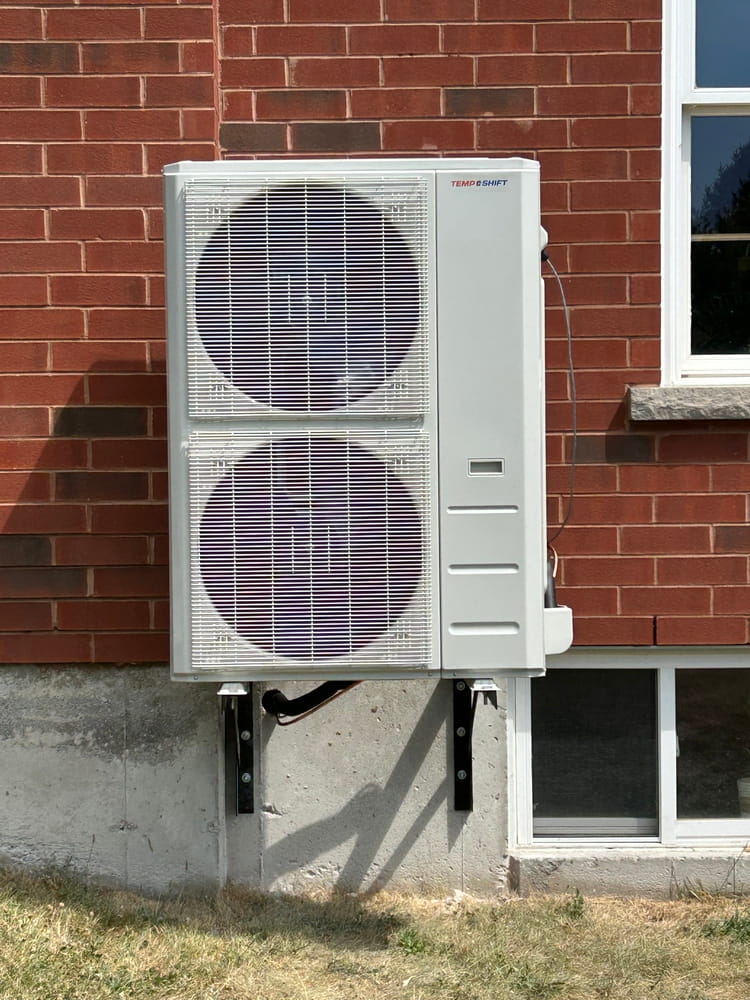 TempShift outdoor unit close-up detail shot showing mounting/finish quality.