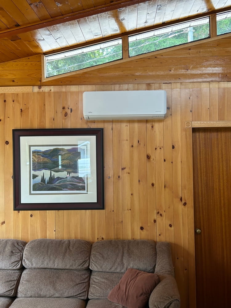 Fujitsu indoor head on wood cottage wall.