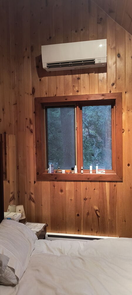 Cottage bedroom with Mitsubishi mini split installed.